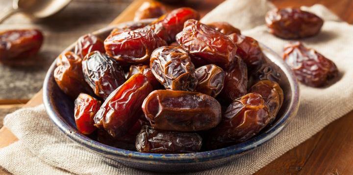 a cup of dates on the table-relieve constipation