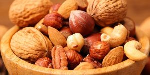 a cup of mixed nuts / nuts can give you heartburn